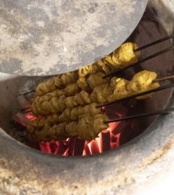 Close up of chicken skewers in an tandoori oven